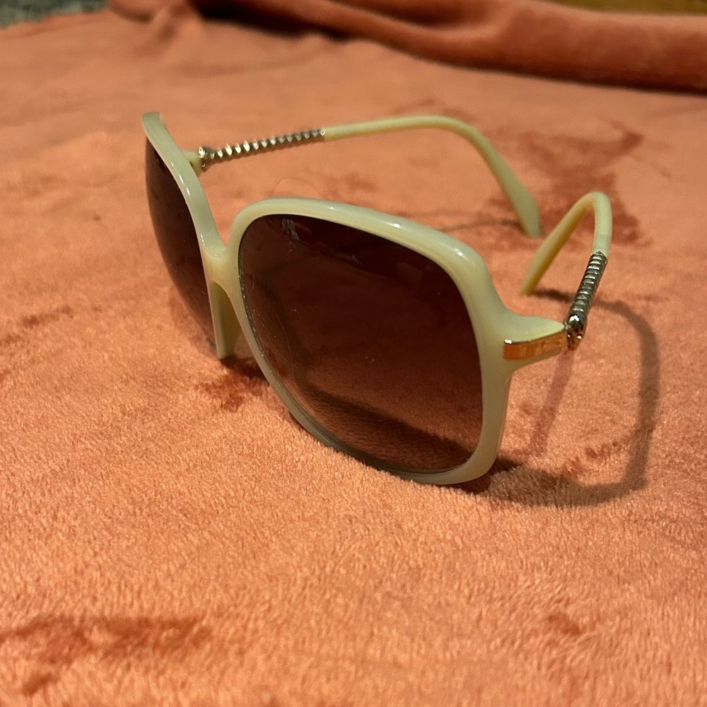 Alexander McQueen sunglasses with skulls on the side